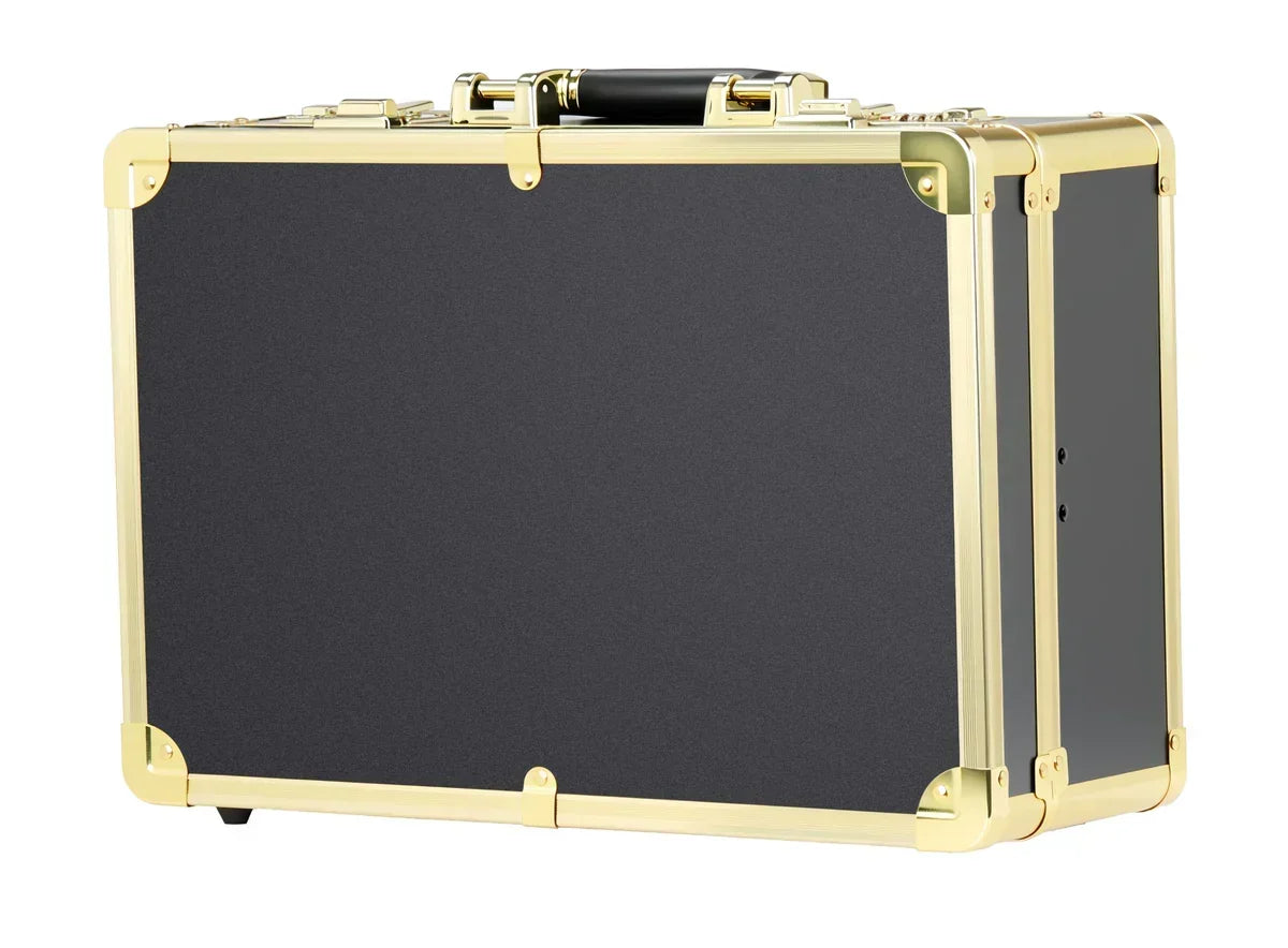 Black suitcase with gold trim on a white background