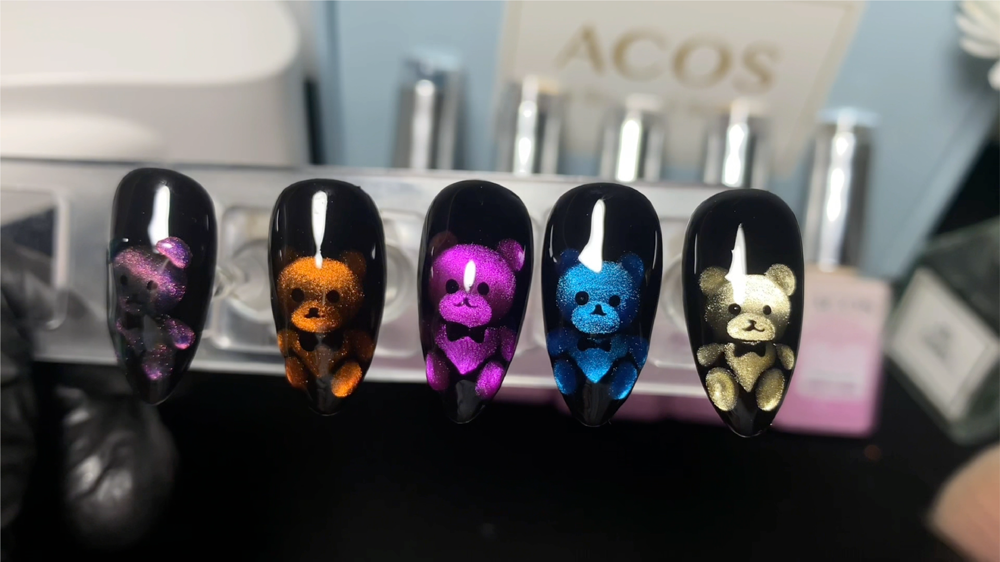Adorable glowing teddy bear cat eye nail designs.
