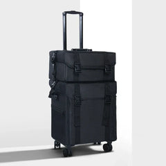 Black suitcase with wheels on a light gray background